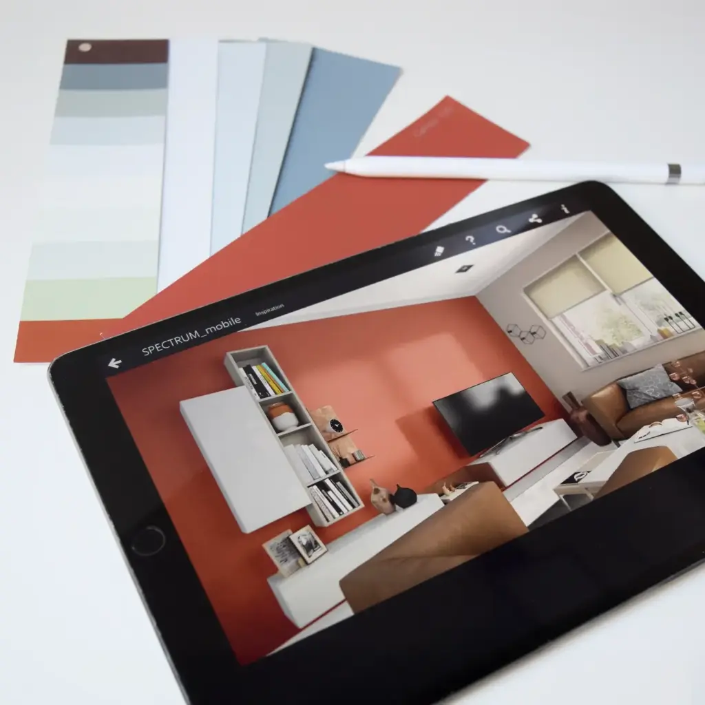 Tablet mit digitaler Raumansicht und Farbkonzepten, das bei der visuellen Darstellung von Wandfarben während der Idee & Planung vom Malerbetrieb in Düsseldorf durch Malermeister Kleinau eingesetzt wird